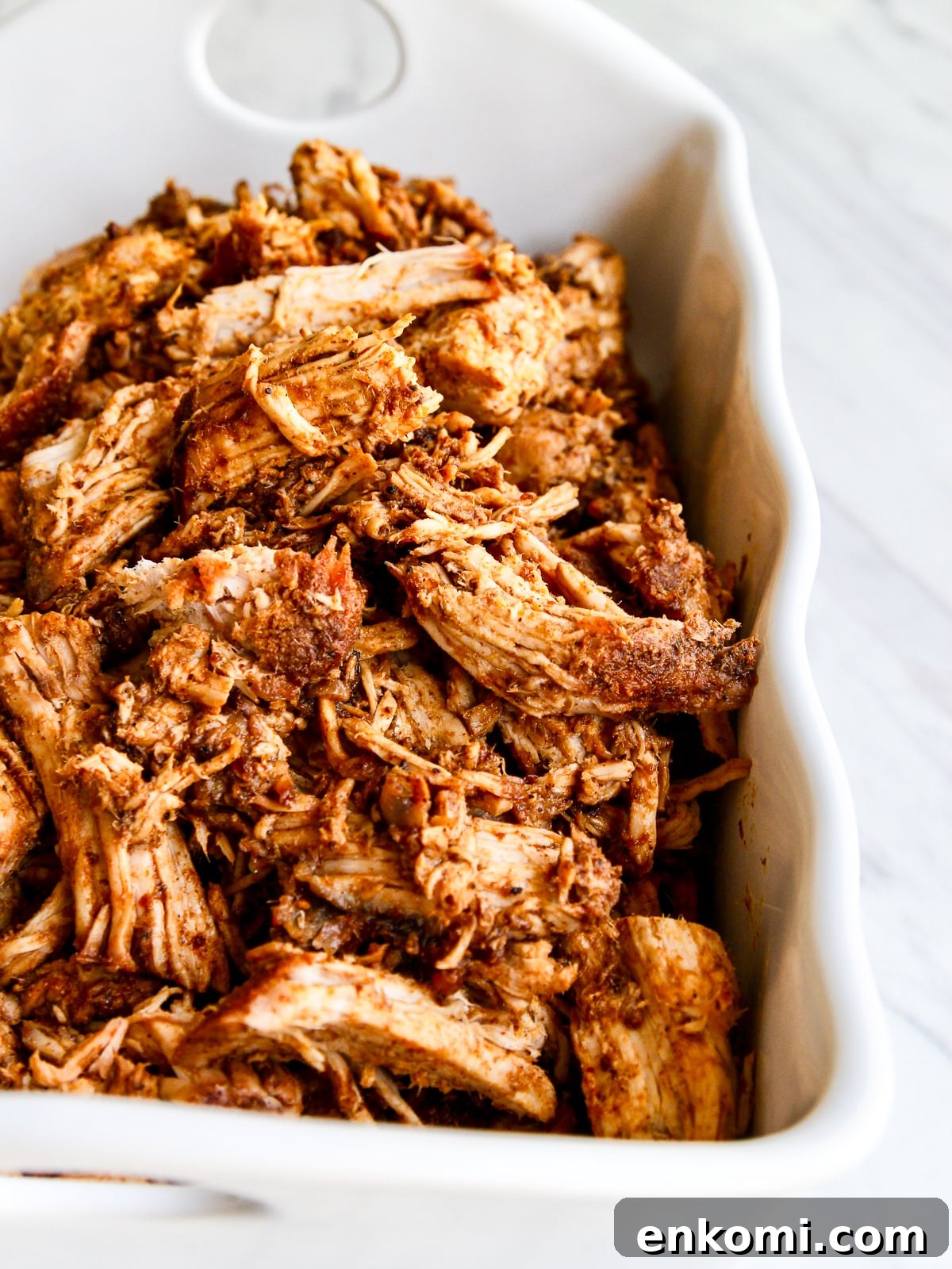 Juicy Oven-Roasted Pulled Pork 13 Roasted pulled pork in a casserole dish