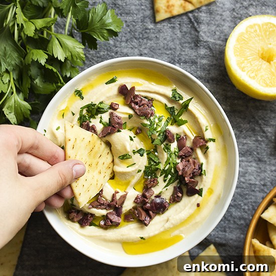 Zahav's classic recipe for Israeli hummus bi tahini is the best homemade hummus you can make! It's silky, smooth, creamy, light, and addictively yummy.