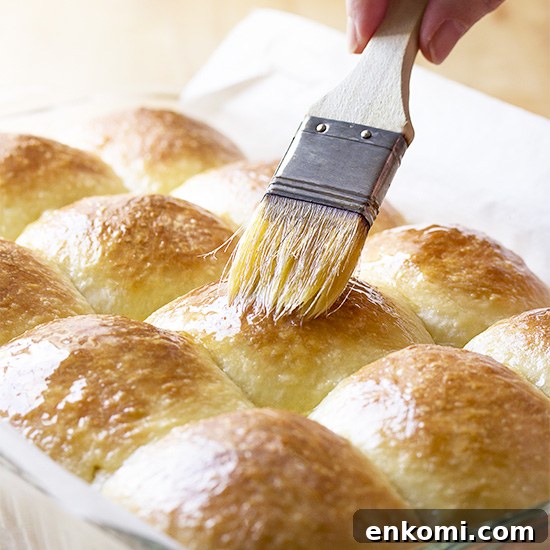 Enjoy fresh bread without the fuss and bother. These super soft and fluffy no-knead dinner rolls are super easy too! Stir together the ingredients in a bowl, let it rise, shape, and bake. Perfect for Thanksgiving, Christmas, or any holiday dinner. | justalittlebitofbacon.com #nokneadbread #dinnerrolls #freshbread #thanksgiving #holidaybaking
