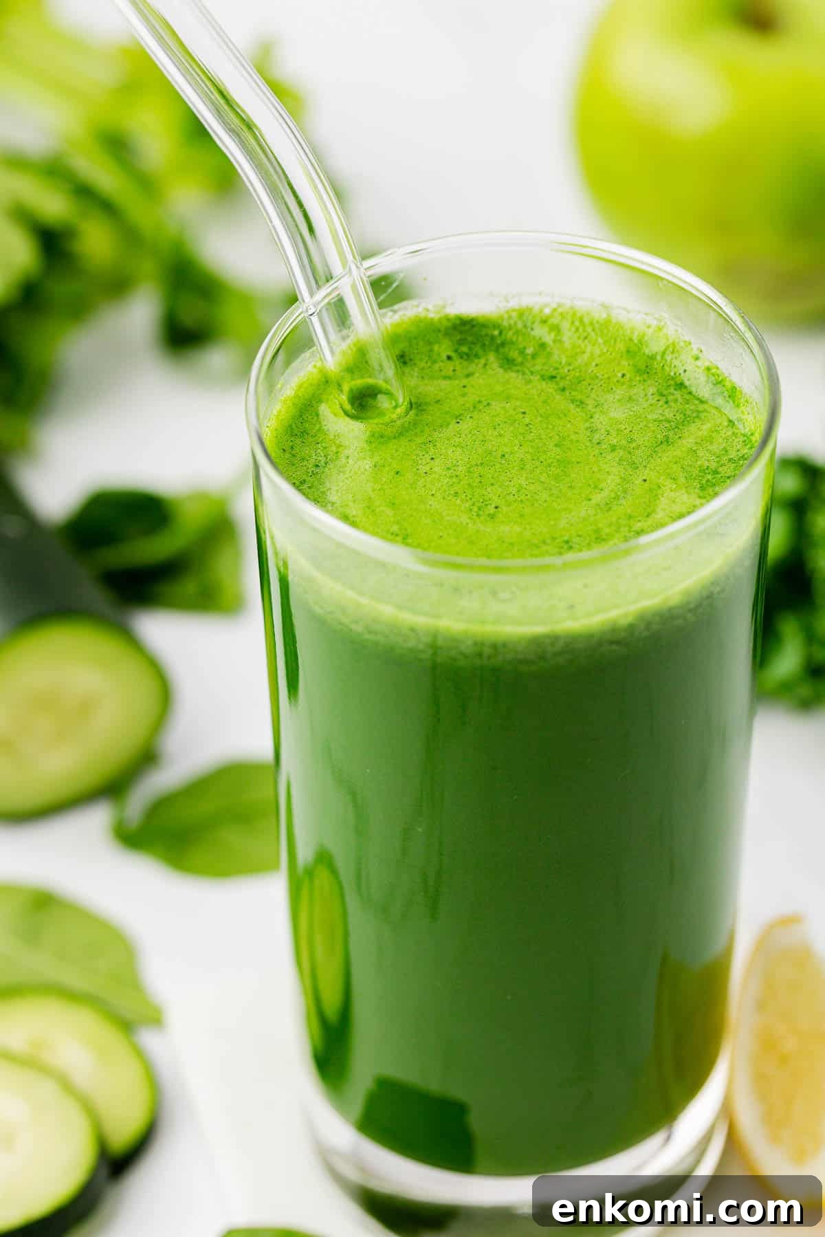 Refreshing Homemade Green Juice Recipe for Energy and Detox 8 green juice in a glass with a straw