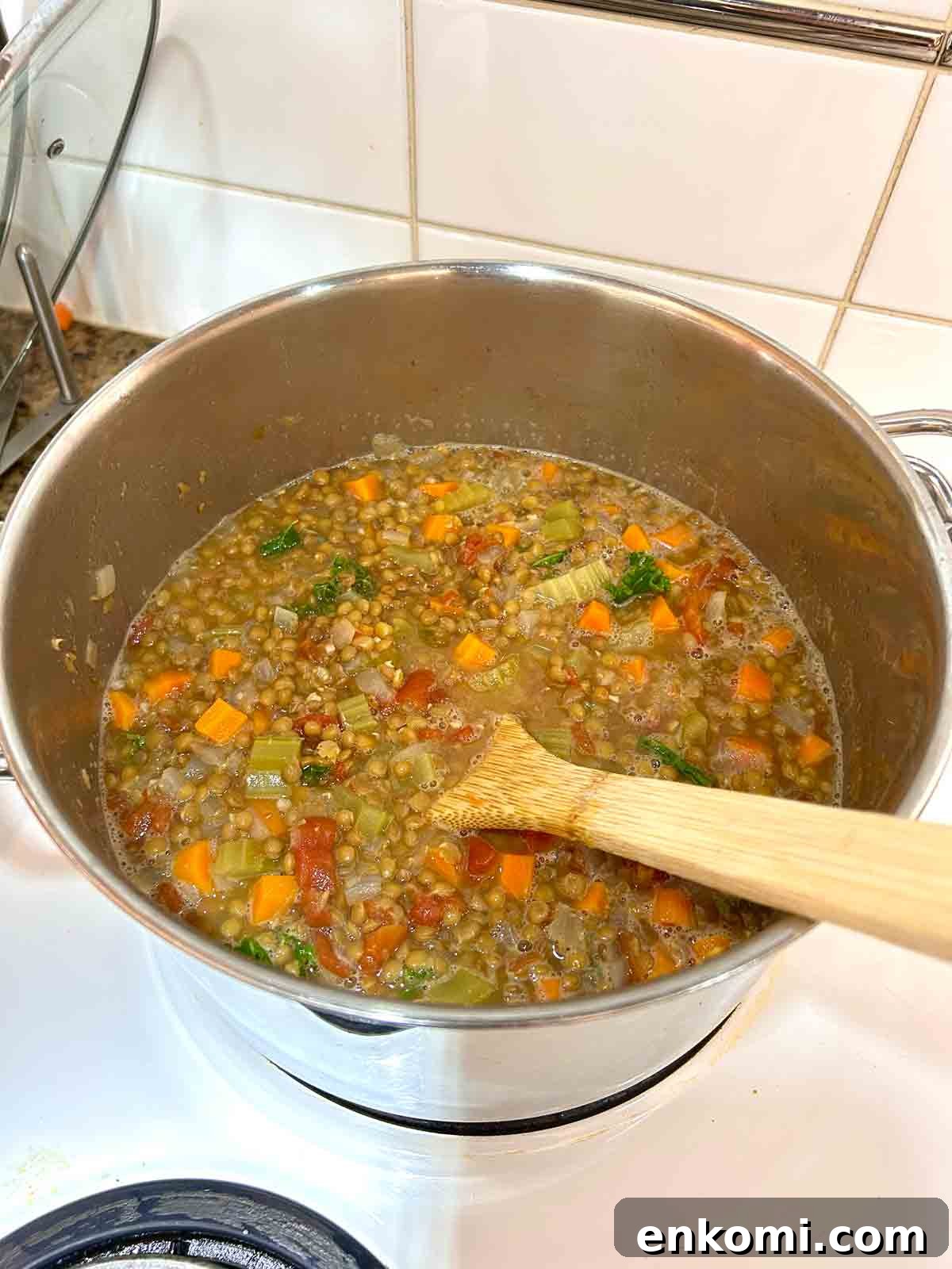 kale and lemon juice stirred into lentil soup.