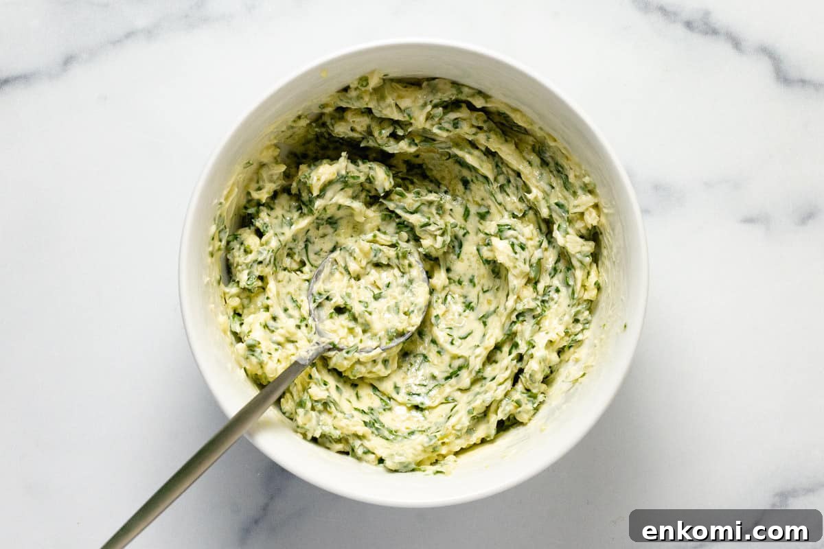 A small bowl filled with creamy homemade garlic butter