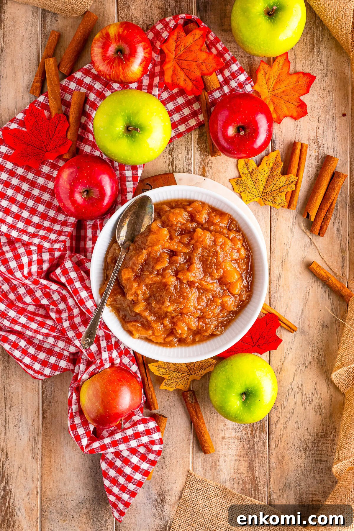 overhead image of homemade crock pot applesauce in a white bowl
