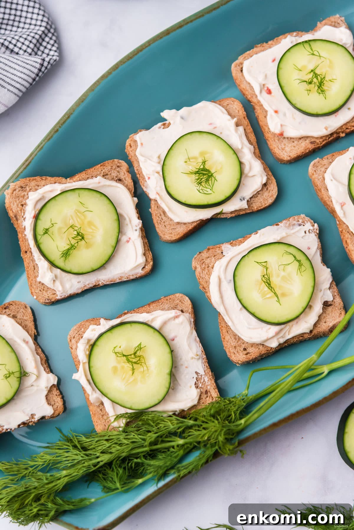 Mini Cucumber Tea Sandwiches for Parties and Picnics 3 CUCUMBER SANDWICHES ON A BLUE PLATTER