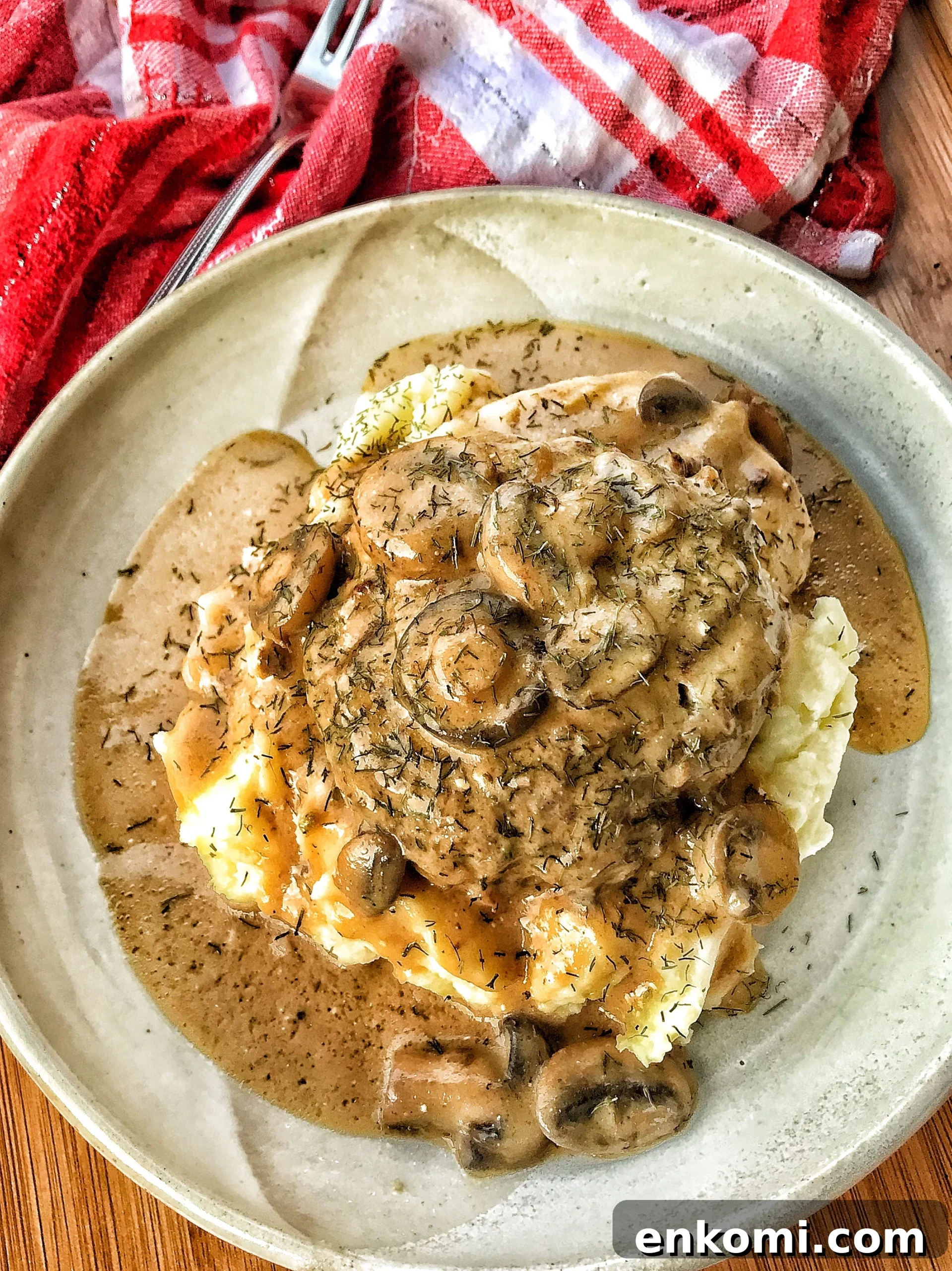 Polish hamburger over potatoes seen from above