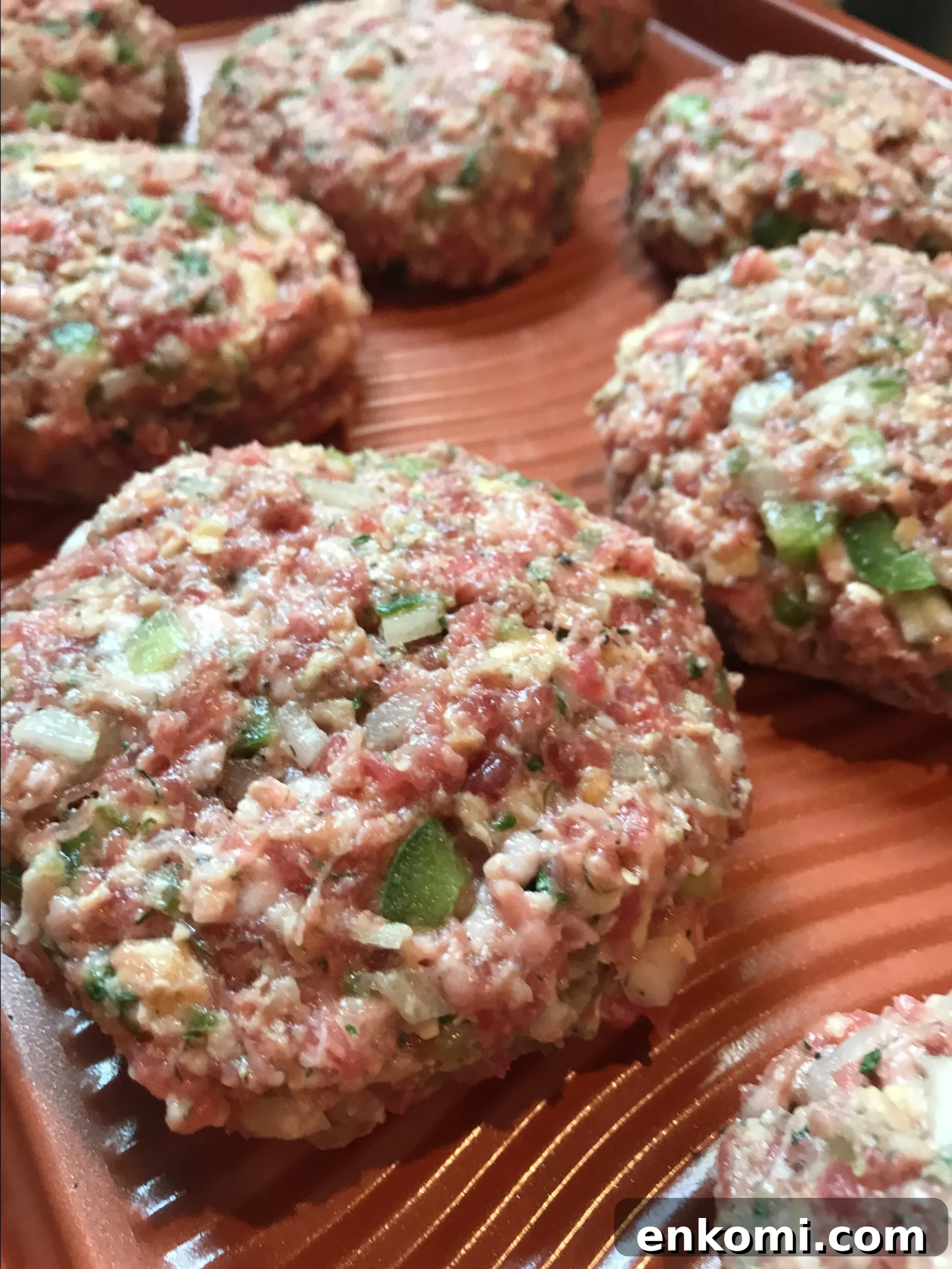 The meat mixture formed into burger shapes