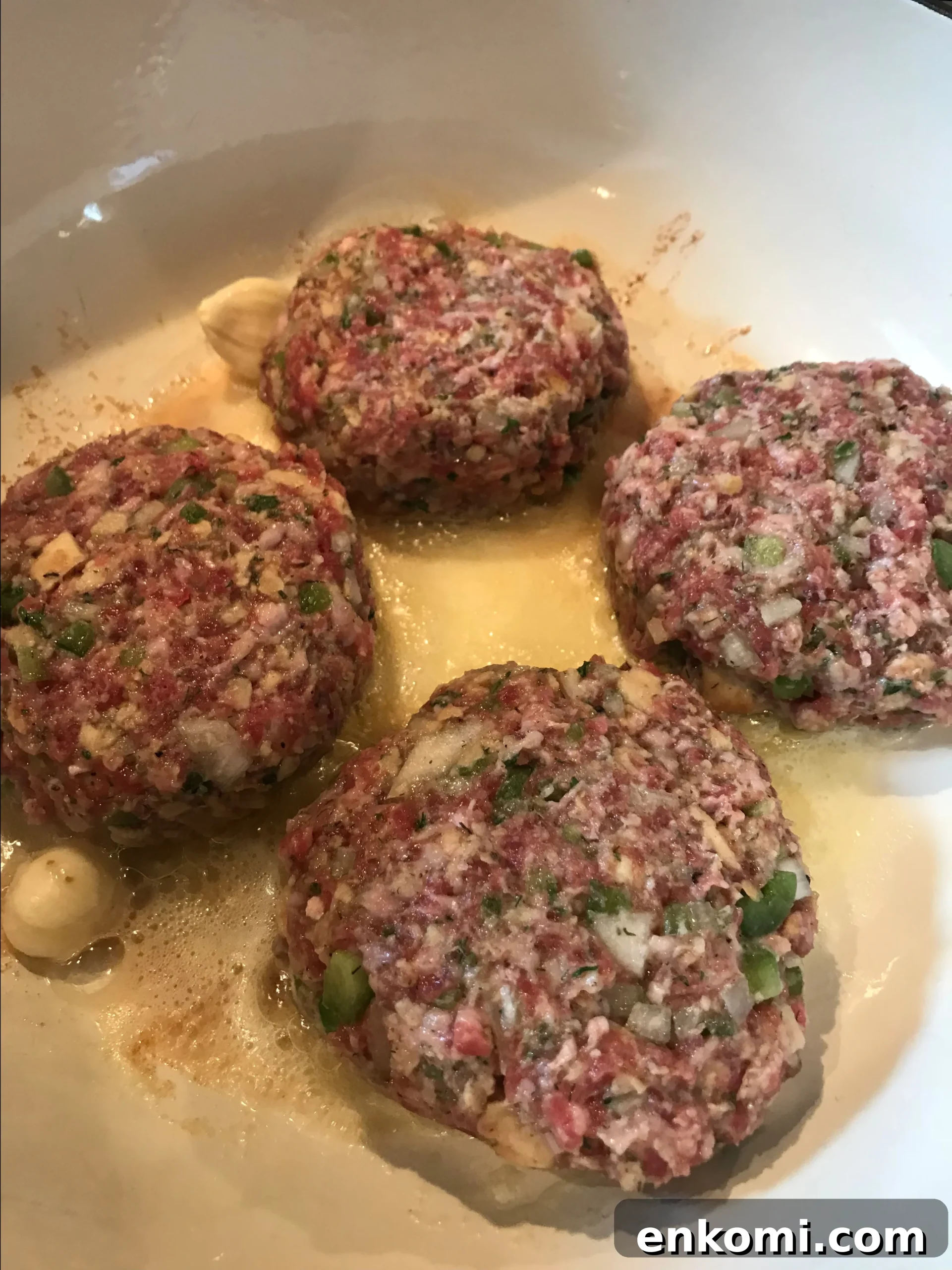 Burgers cooking in the pan