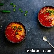 Two bowls filled with venison chili with beer.