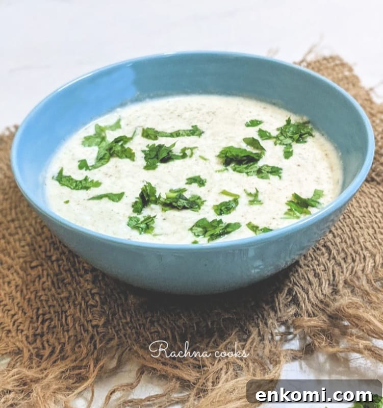 Cucumber Raita: Authentic Indian Cucumber Salad Recipe 2 Indian cucumber salad or cucumber raita in a blue bowl.