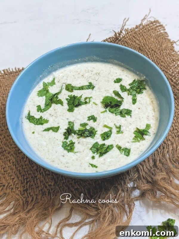 Cucumber Raita: Authentic Indian Cucumber Salad Recipe 6 Indian cucumber salad or cucumber raita in a blue bowl.