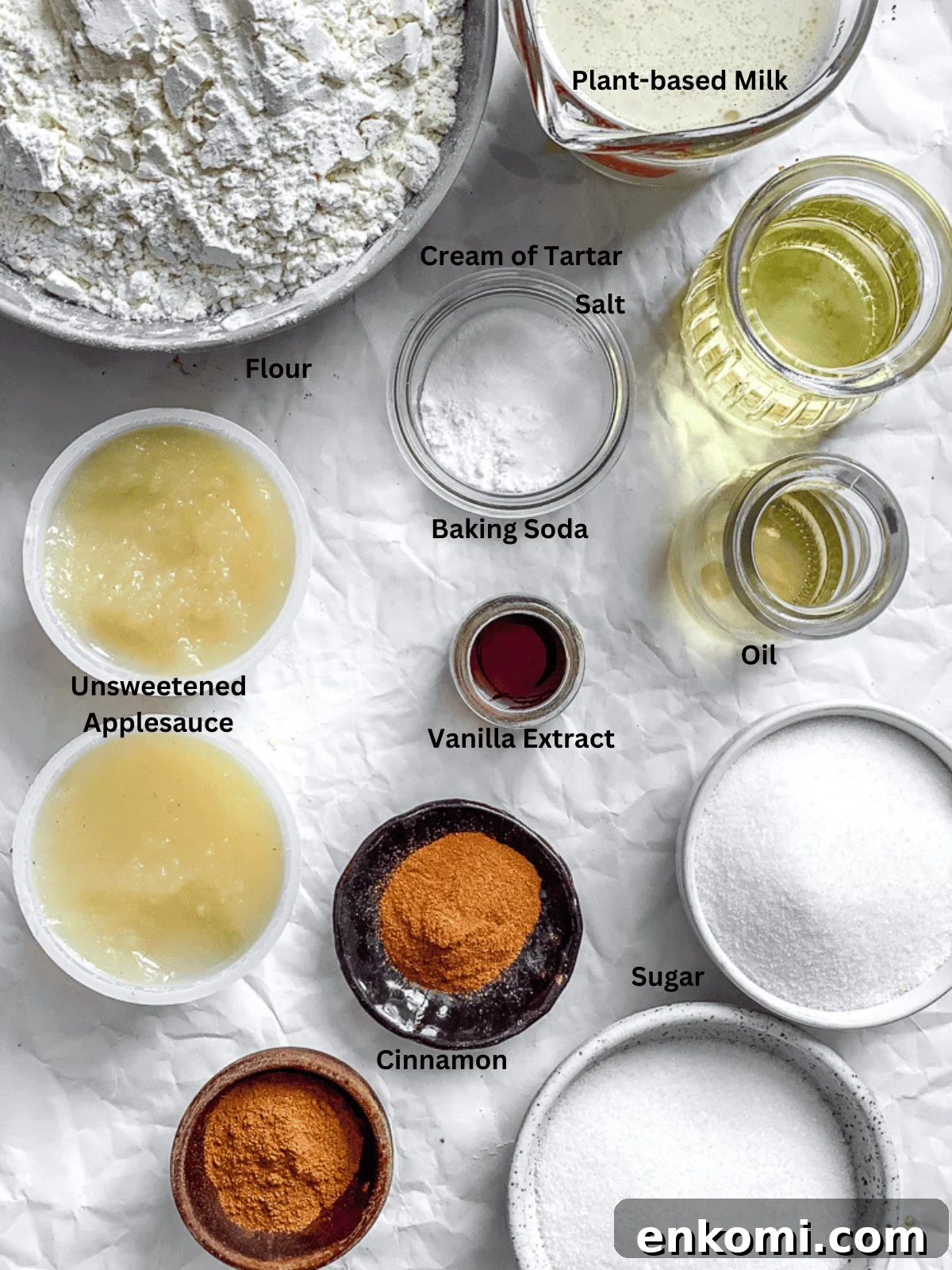 Ingredients for Snickerdoodle Muffins (Egg-Free) measured out on a white surface.