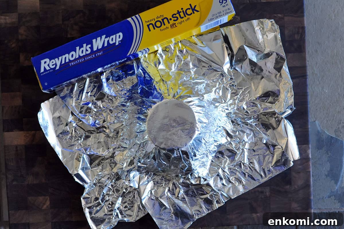 two sheets of foil pressed onto an upside down bowl.