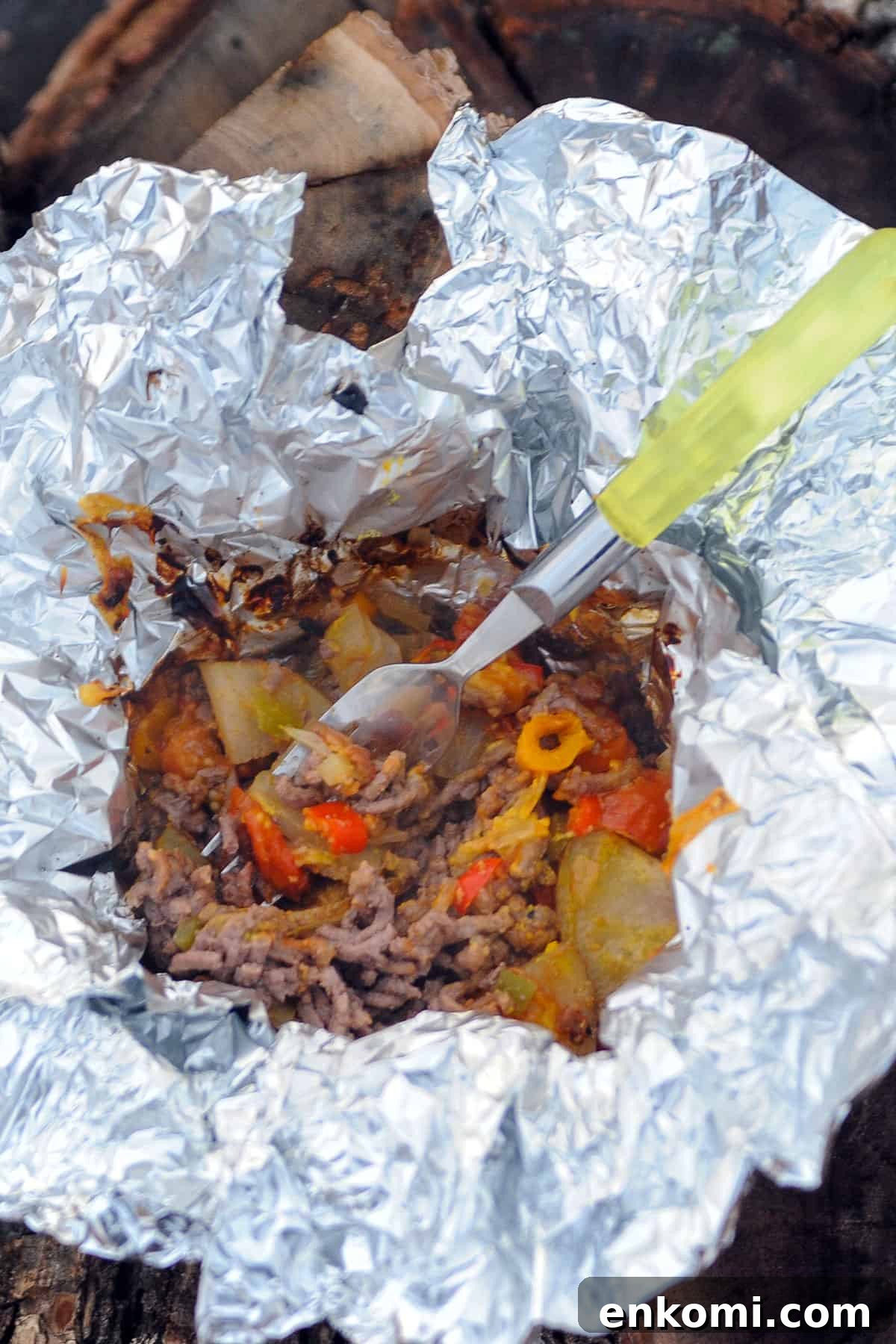 spoon inside opened pouch of hobo stew.