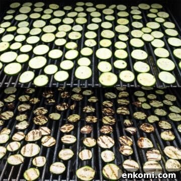Zucchini being grilled on the grill.