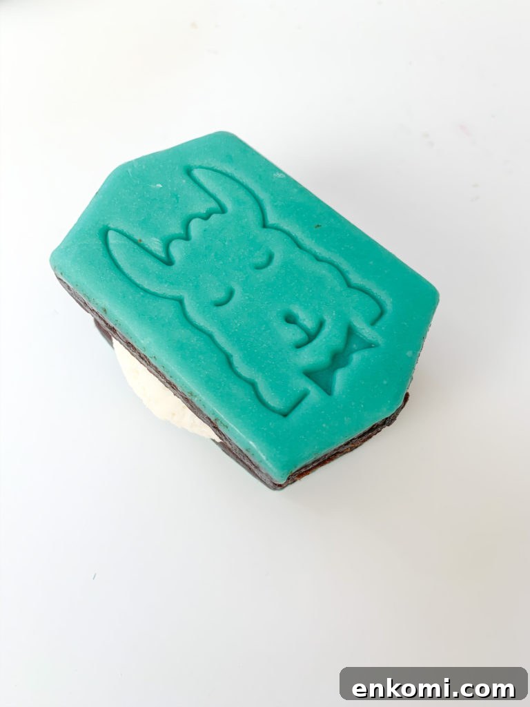 llama ice cream sandwich being finished with sprinkles