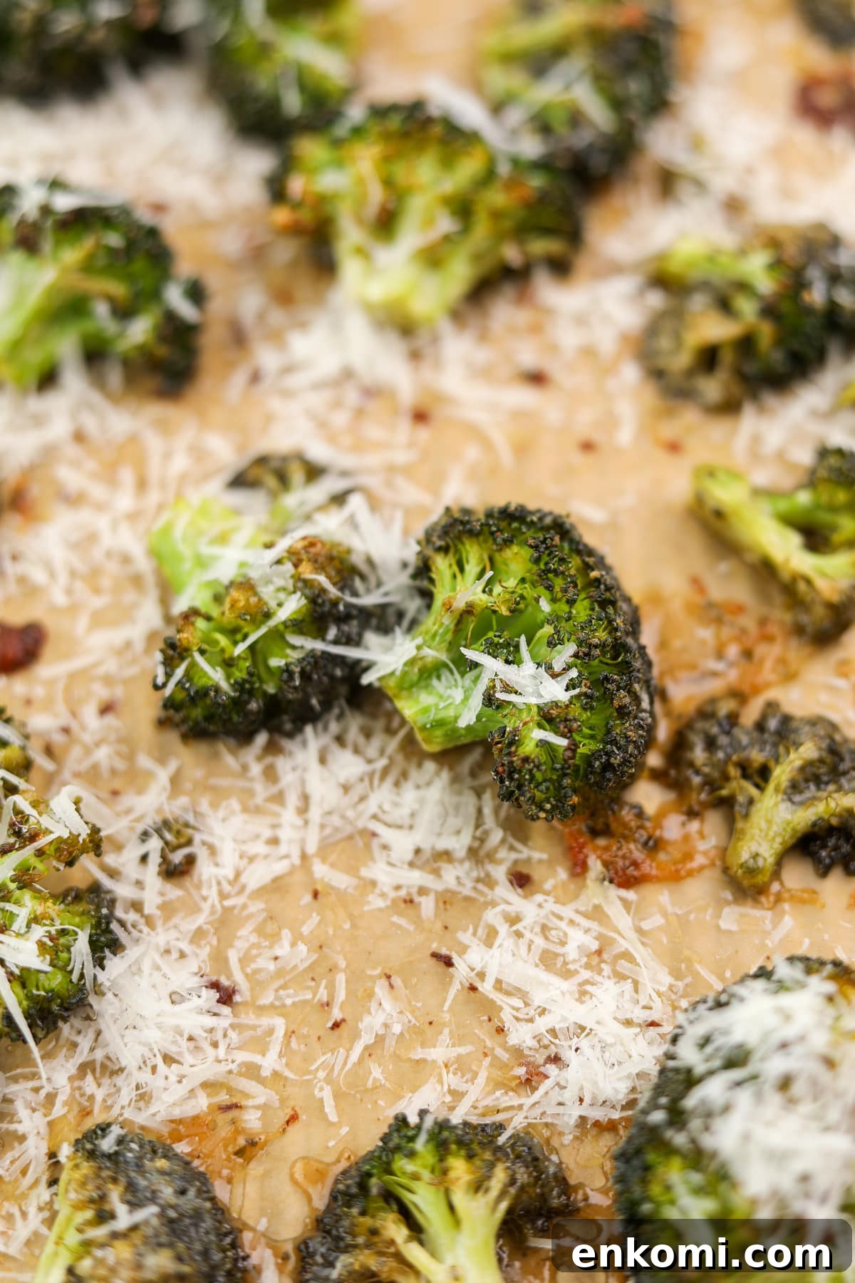 Roasted broccoli florets topped with parmesan.