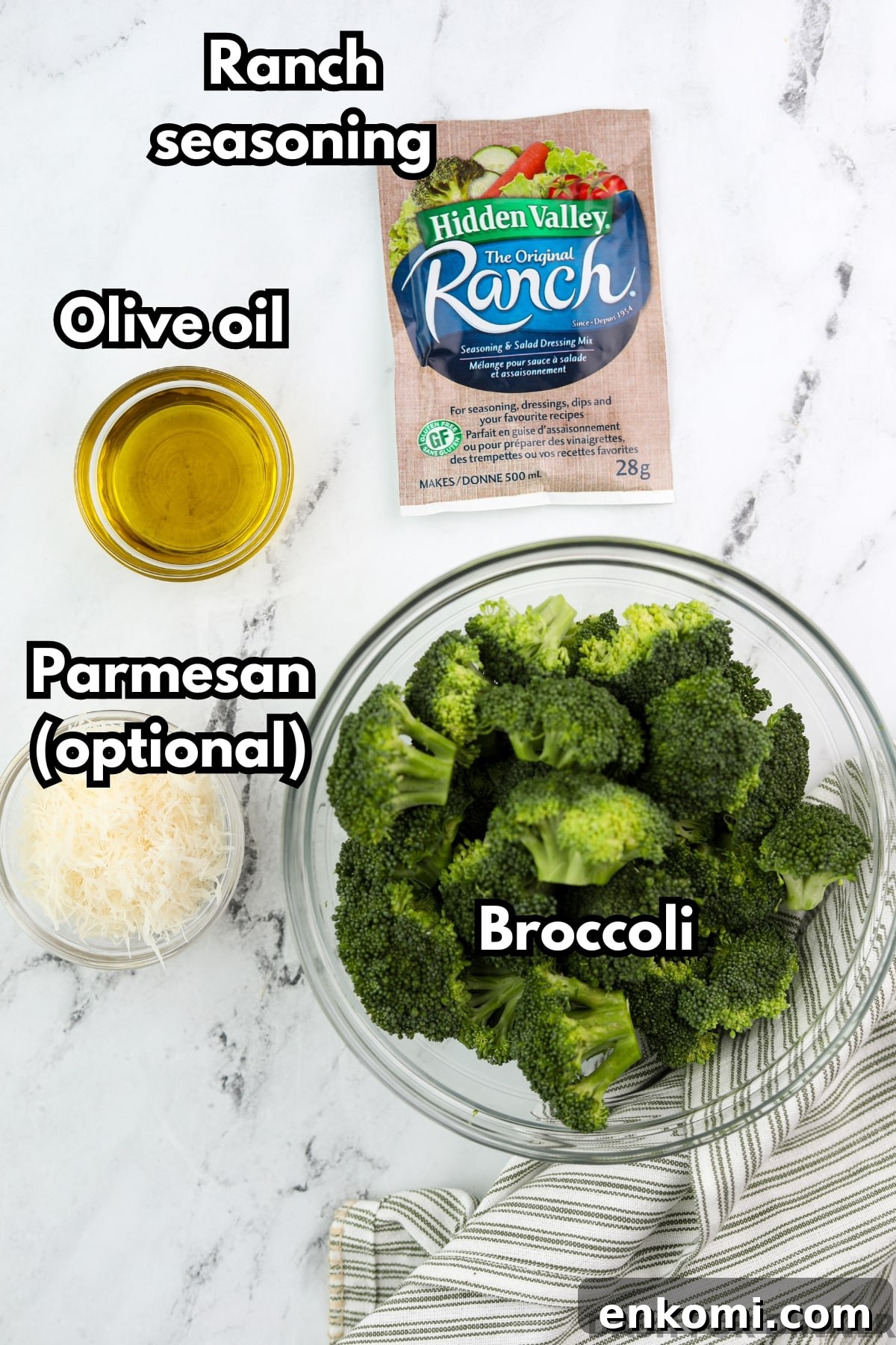 The ingredients needed to make ranch broccoli: broccoli, olive oil, ranch seasoning, and parmesan cheese.