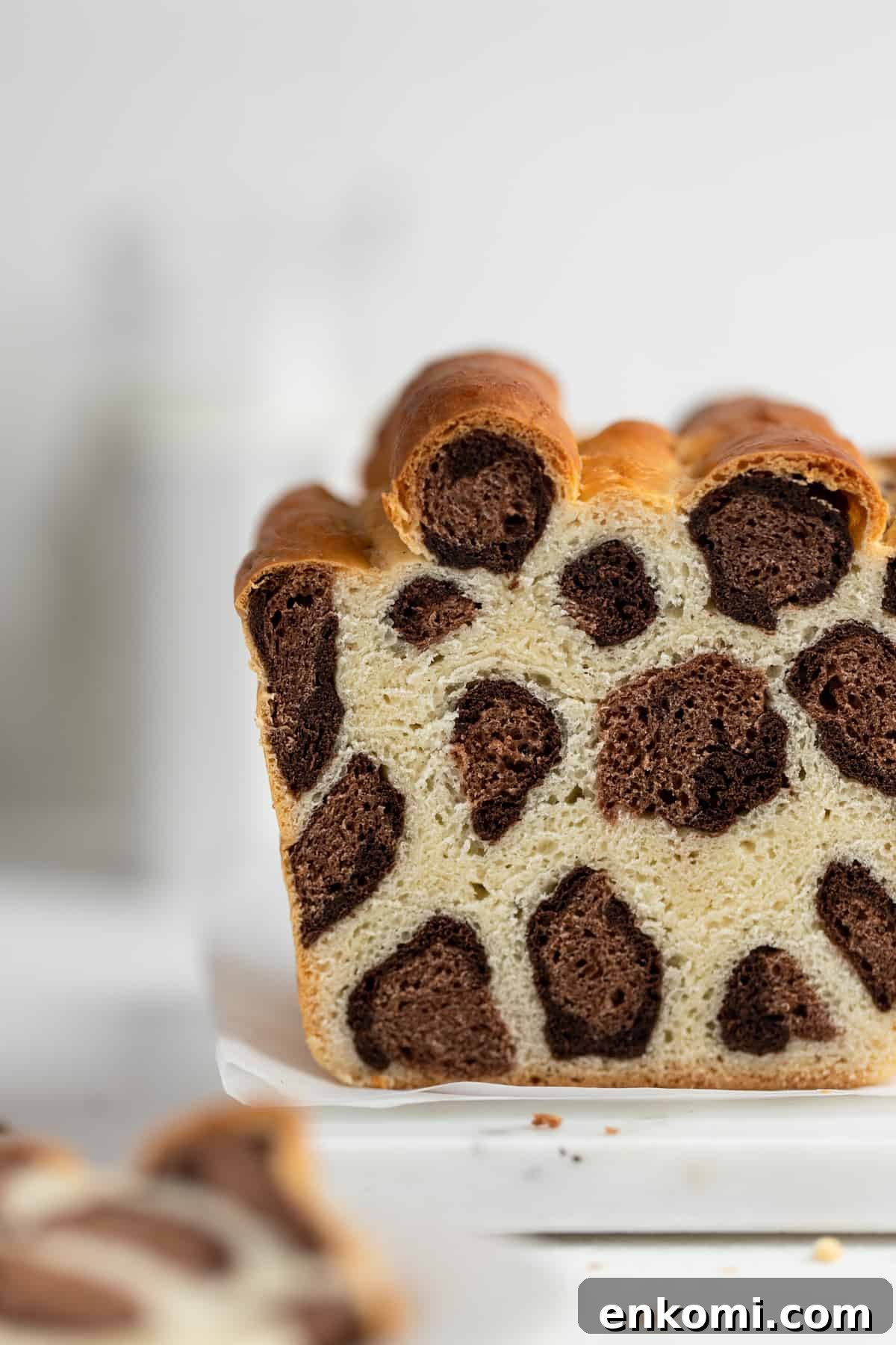 Leopard Milk Bread: Soft Spotted Loaf Recipe 5 Leopard milk bread with leopard patch pattern on parchment paper