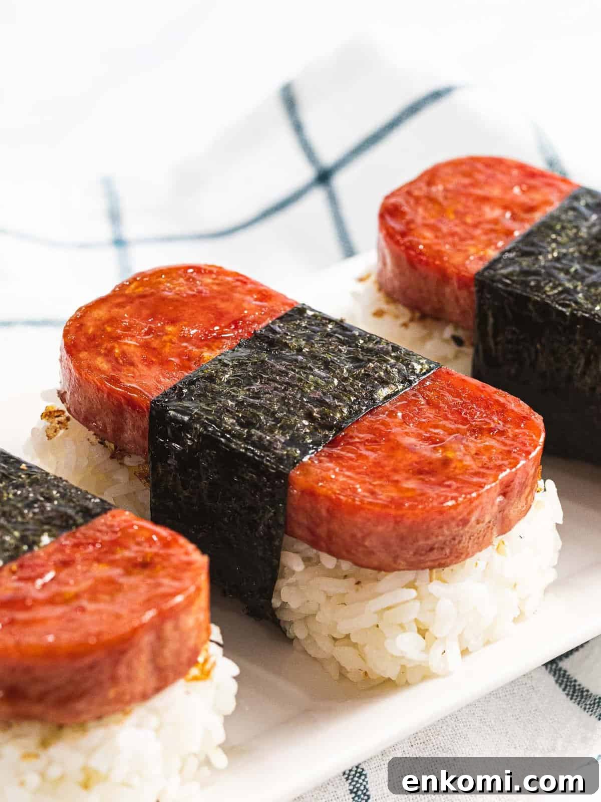 Authentic Hawaiian Spam Musubi Recipe 3 Spam musubi, rice topped with spam and wrapped in nori.