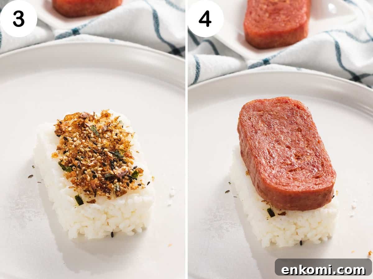 Authentic Hawaiian Spam Musubi Recipe 6 Rice topped with furikake and a slice of spam.