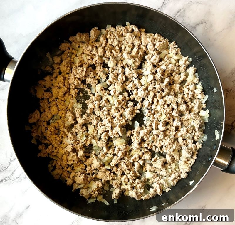 One-Pan Egg Roll Bowls with Ground Pork and Cabbage 4 Cooked ground turkey with onions, garlic, and ginger.