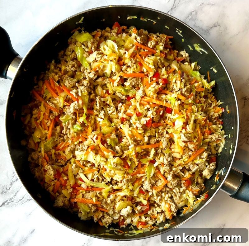 One-Pan Egg Roll Bowls with Ground Pork and Cabbage 6 Cooked carrots and cabbage with ground turkey.