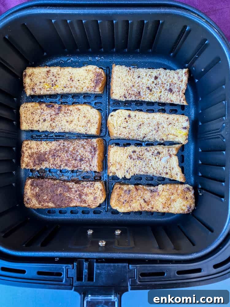 Crispy Air Fryer French Toast Sticks Recipe 7 uncooked French toast sticks in an air fryer