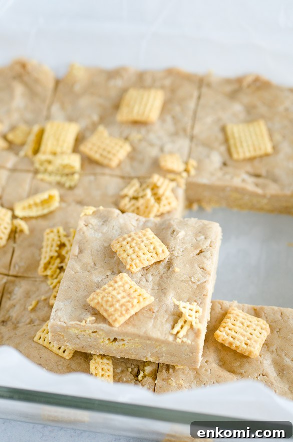 A pan of homemade protein bars topped with Chex cereal