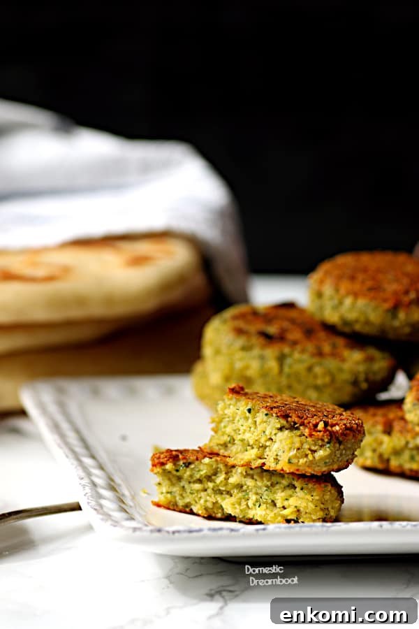 Two halves of a falafel stacked on top of another.