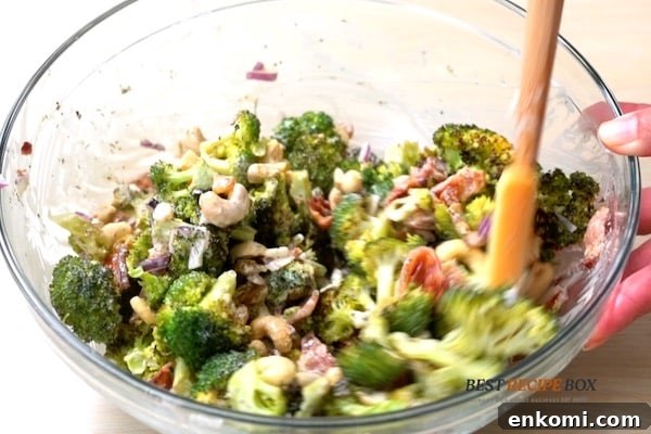 Stirring salad together in a bowl