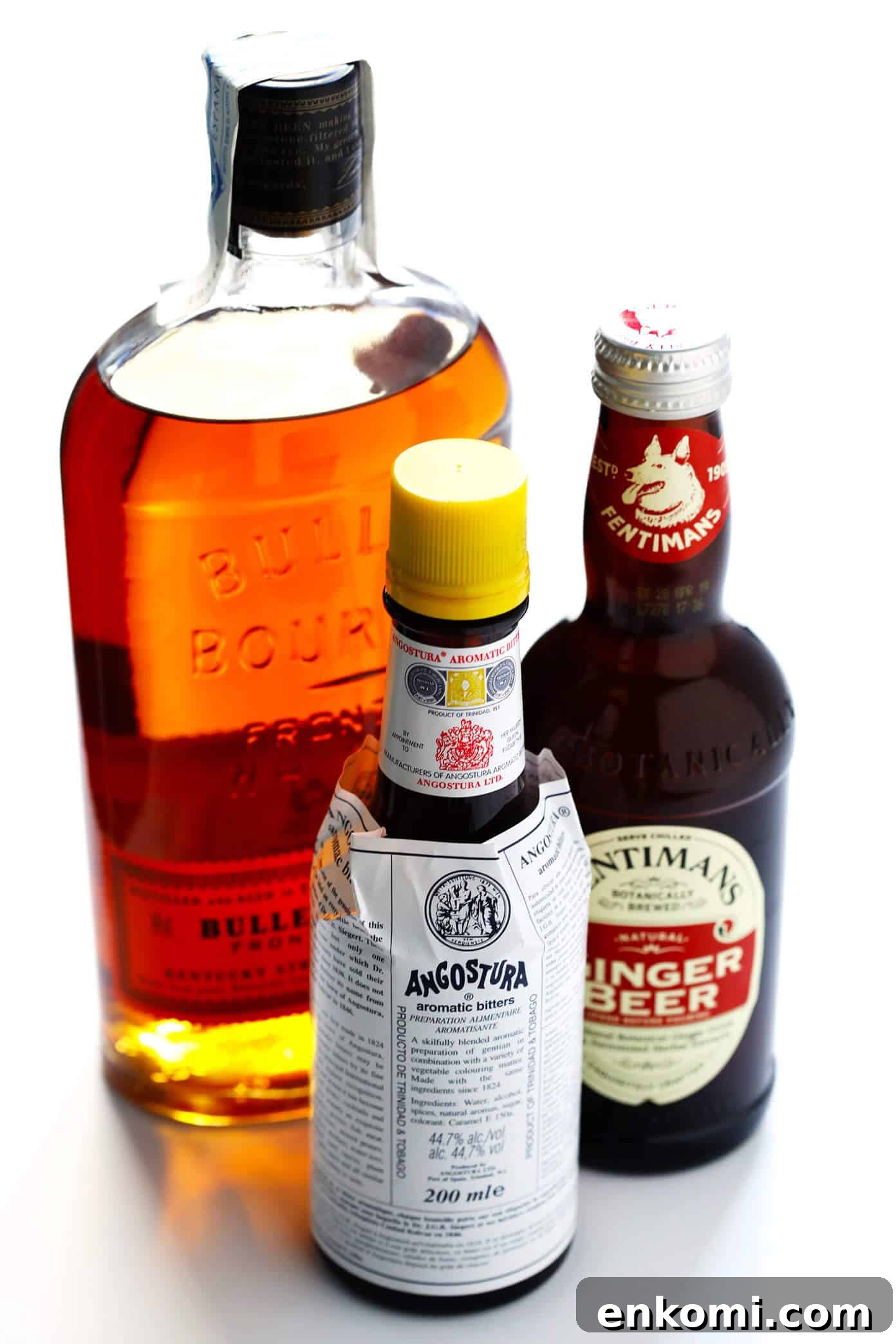 Ingredients for a Horsefeather Cocktail: bourbon, bitters, ginger beer