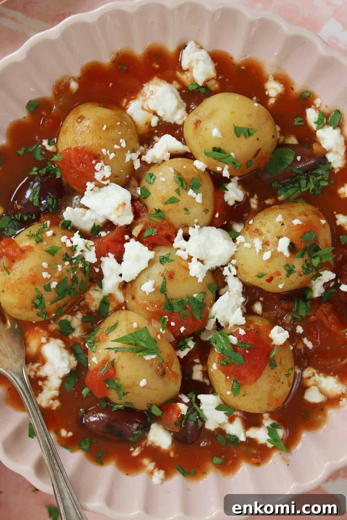Slow Cooker Greek Potato Stew with Feta and Lemon 2 A bowl of Greek potato stew.
