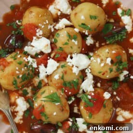 Slow Cooker Greek Potato Stew with Feta and Lemon 8 A bowl of Greek potato stew.