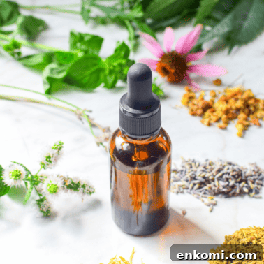 A picture of a tincture bottle and herbs