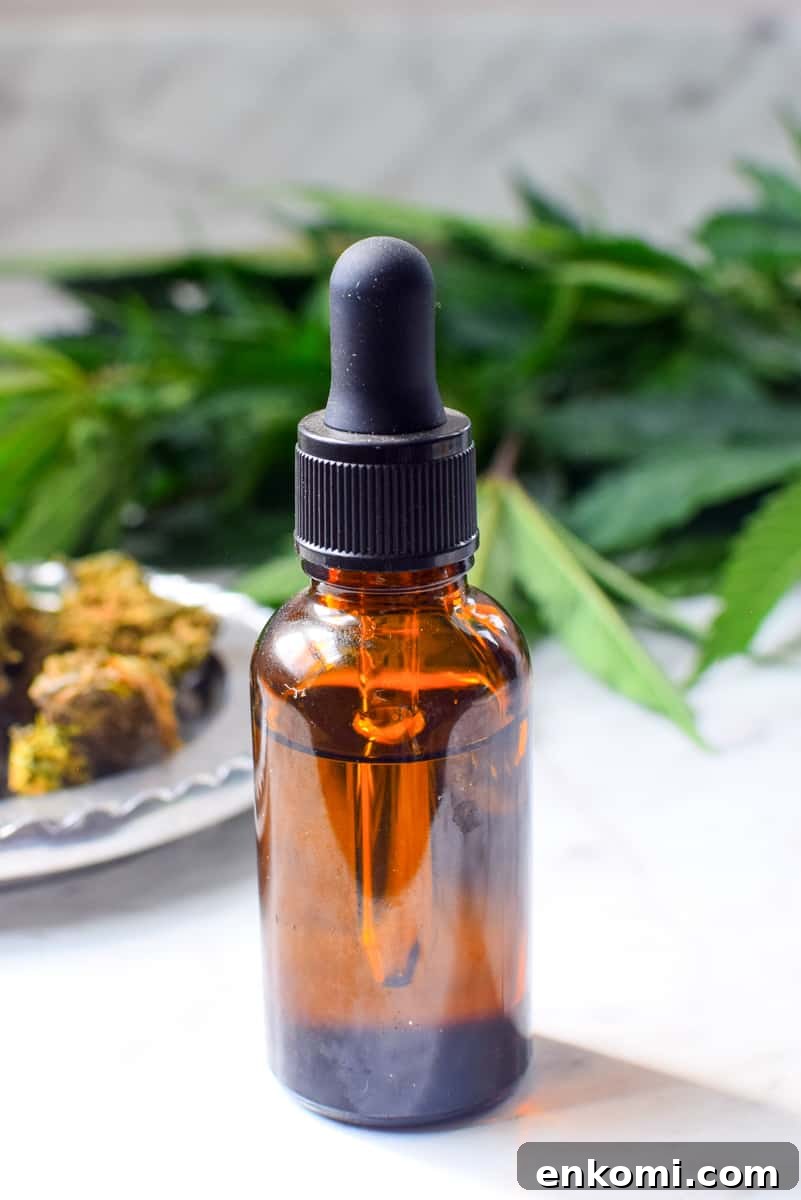 A picture of a tincture bottle and herbs.