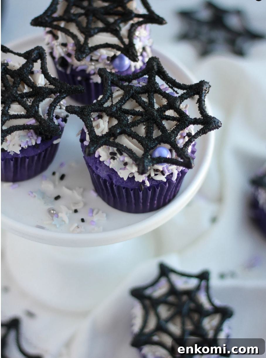 8 Spooky Halloween Cupcake Ideas to Wow Guests 9 Fuzzy spiderweb cupcakes