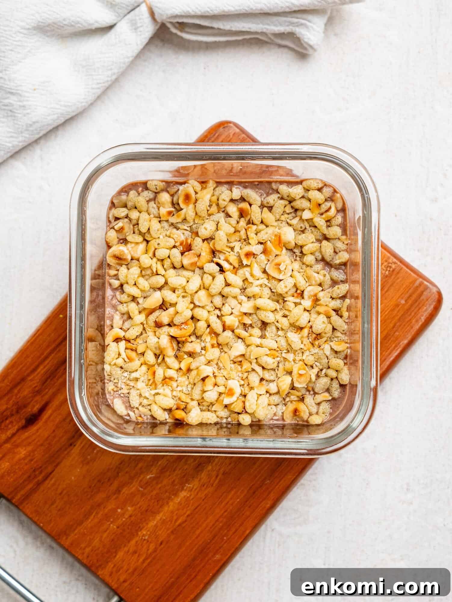 Ferrero Rocher Protein Overnight Oats in a glass meal-prep container.