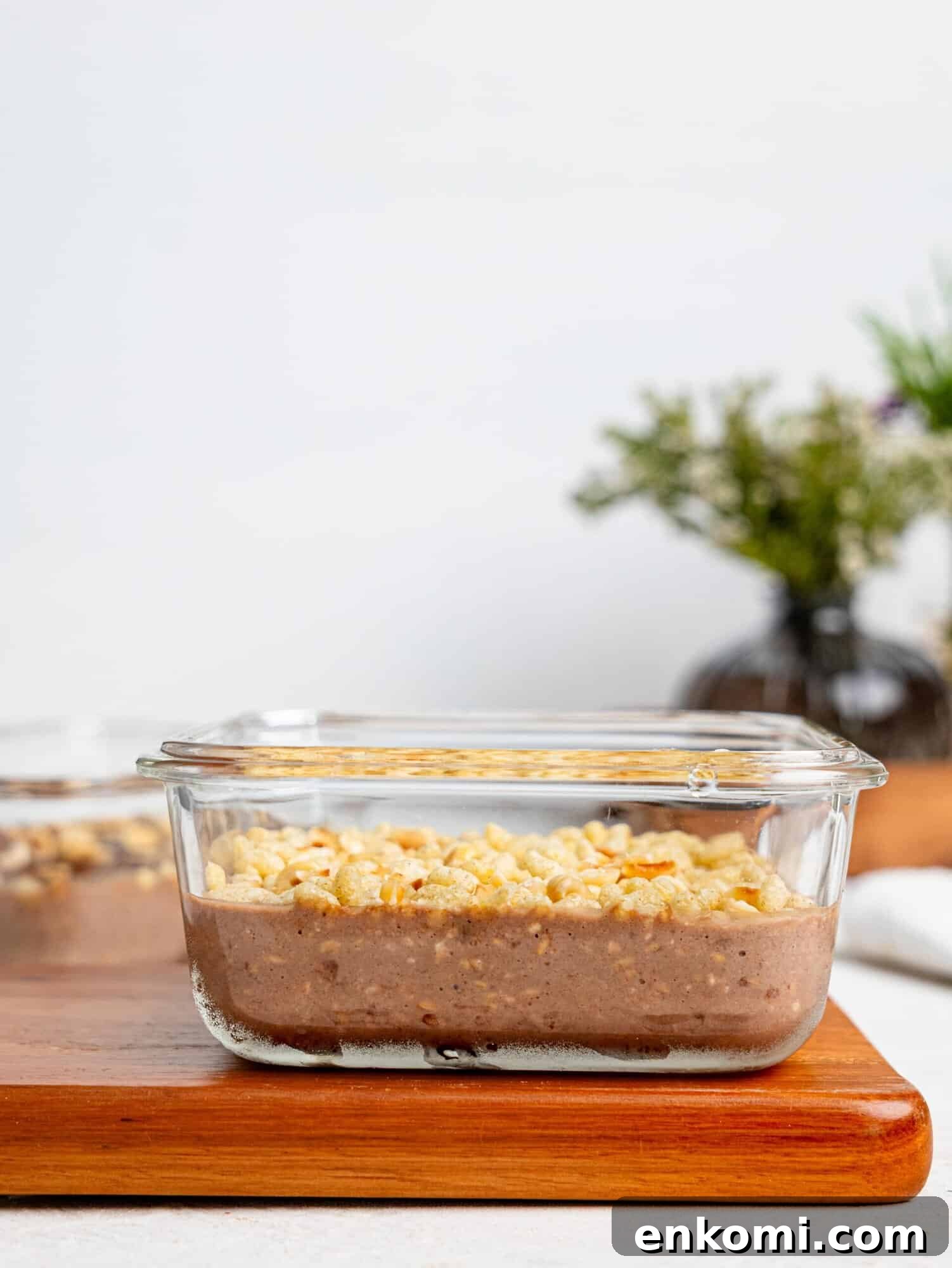 Ferrero Rocher Protein Overnight Oats in a glass meal-prep container.