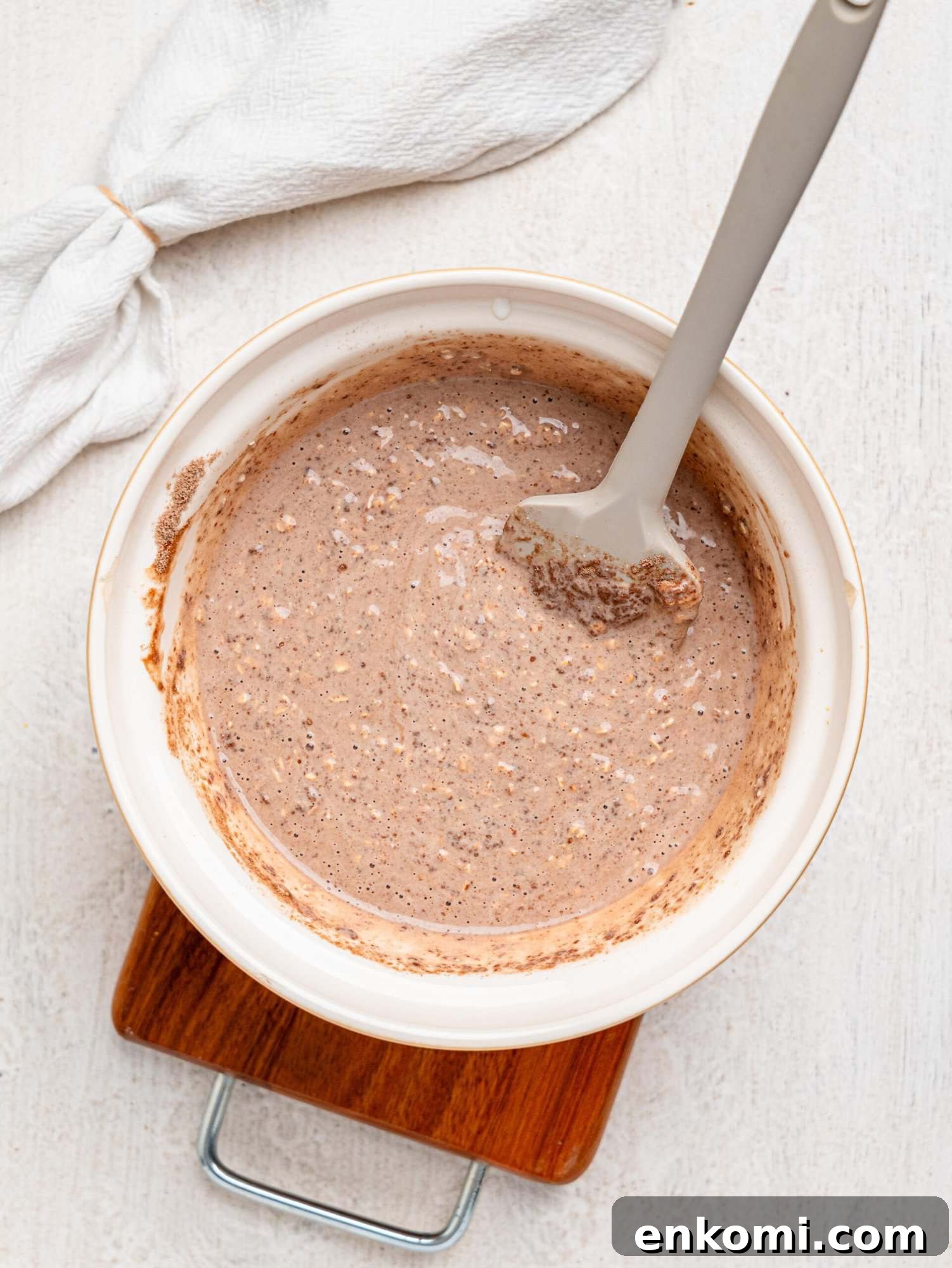 Creamy chocolate protein overnight oats in a mixing bowl.