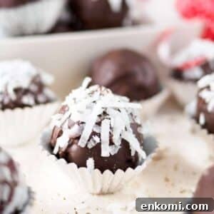 Chocolate coconut and almond truffles on board.