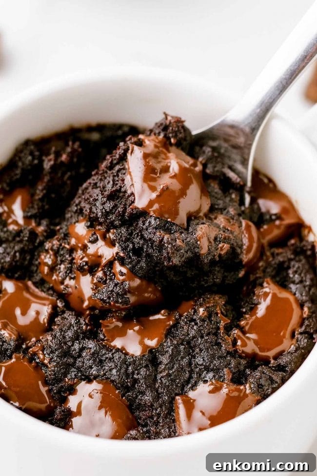 a mug with a brownie in it