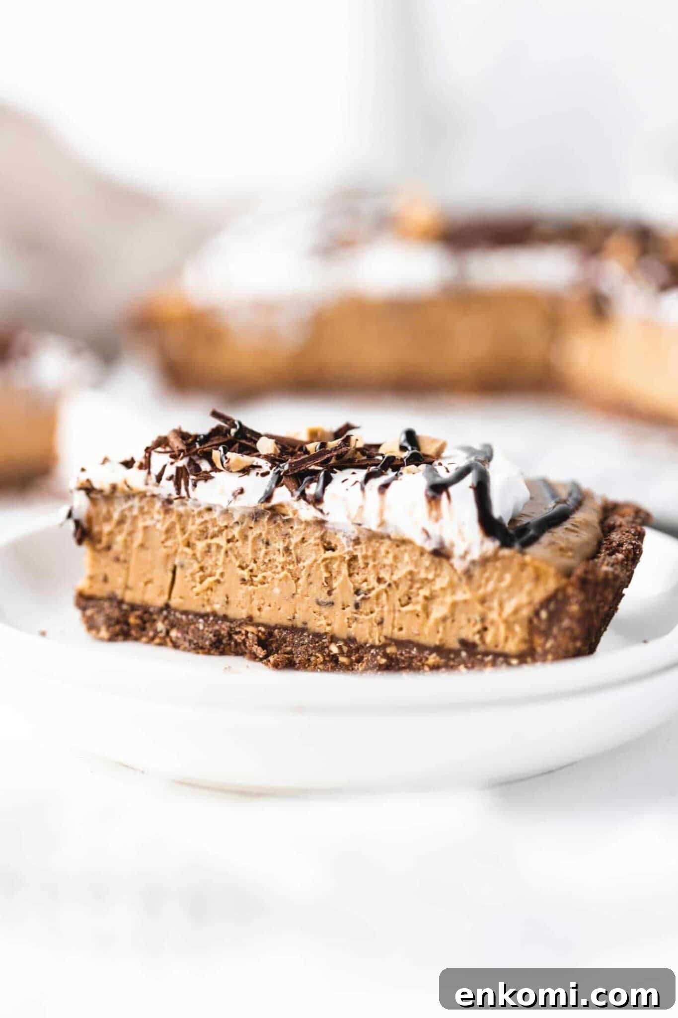 a slice of vegan peanut butter pie with chocolate flakes