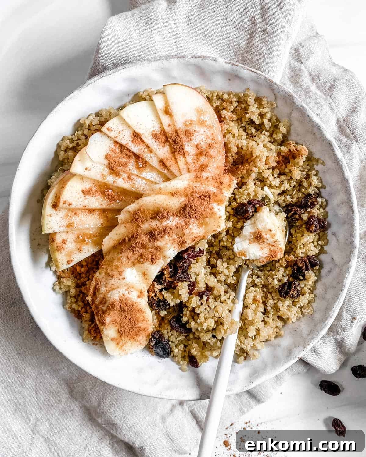 a bowl of quinoa with apples and cinnamon