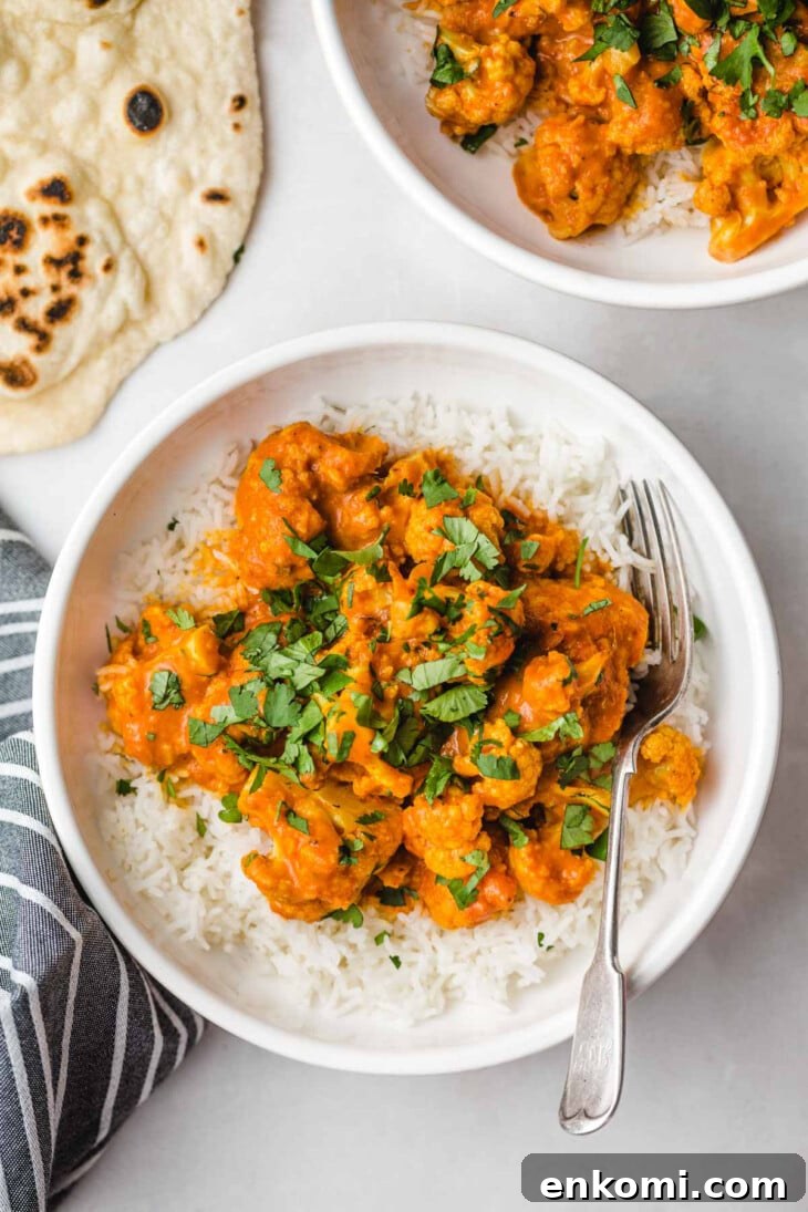 cauliflower in curry sauce on top of rice