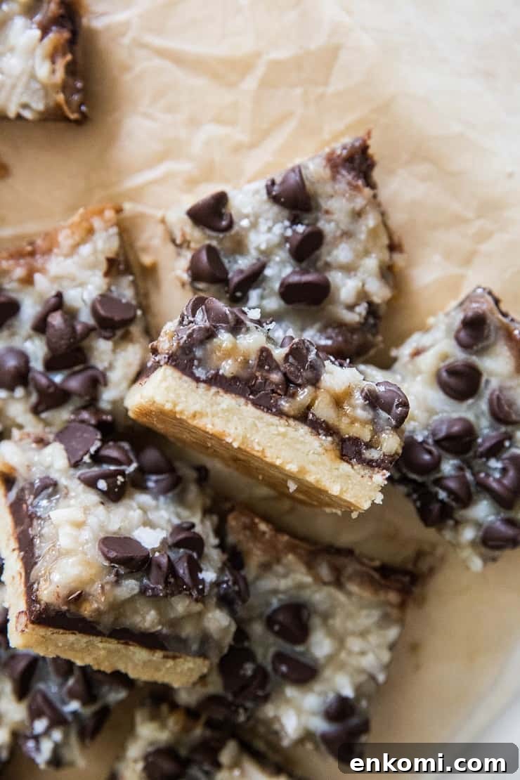 7-Layer Paleo Magic Bars: No-Bake Dessert Bars 4 Sliced magic bars