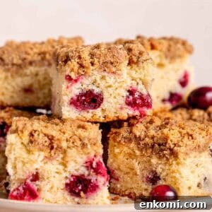 Slices of cranberry coffee cake on a platter.