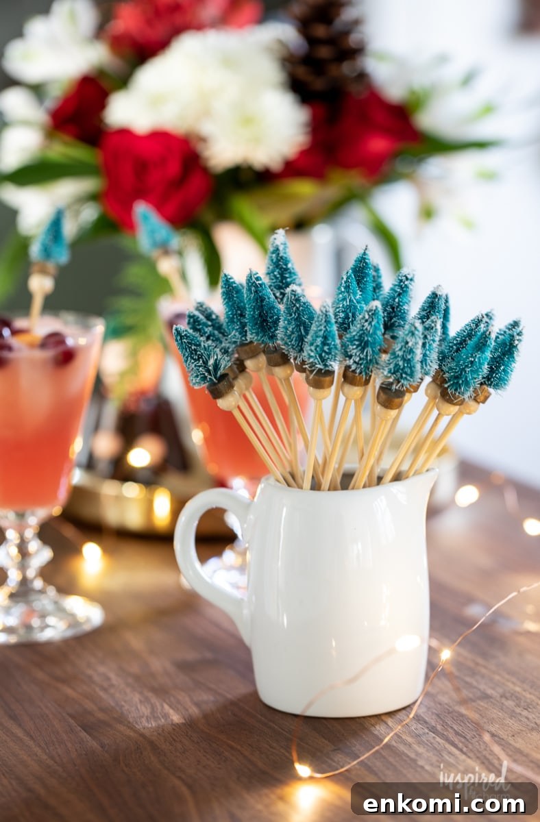 Bottle Brush Tree Drink Stirrers in a small white pitcher.