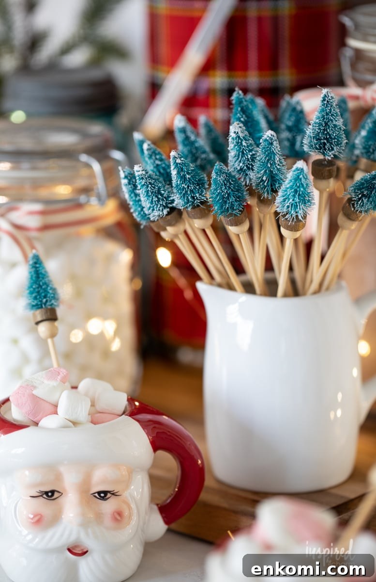 small white pitcher and Santa mug with Bottle Brush Tree Drink Stirrers.
