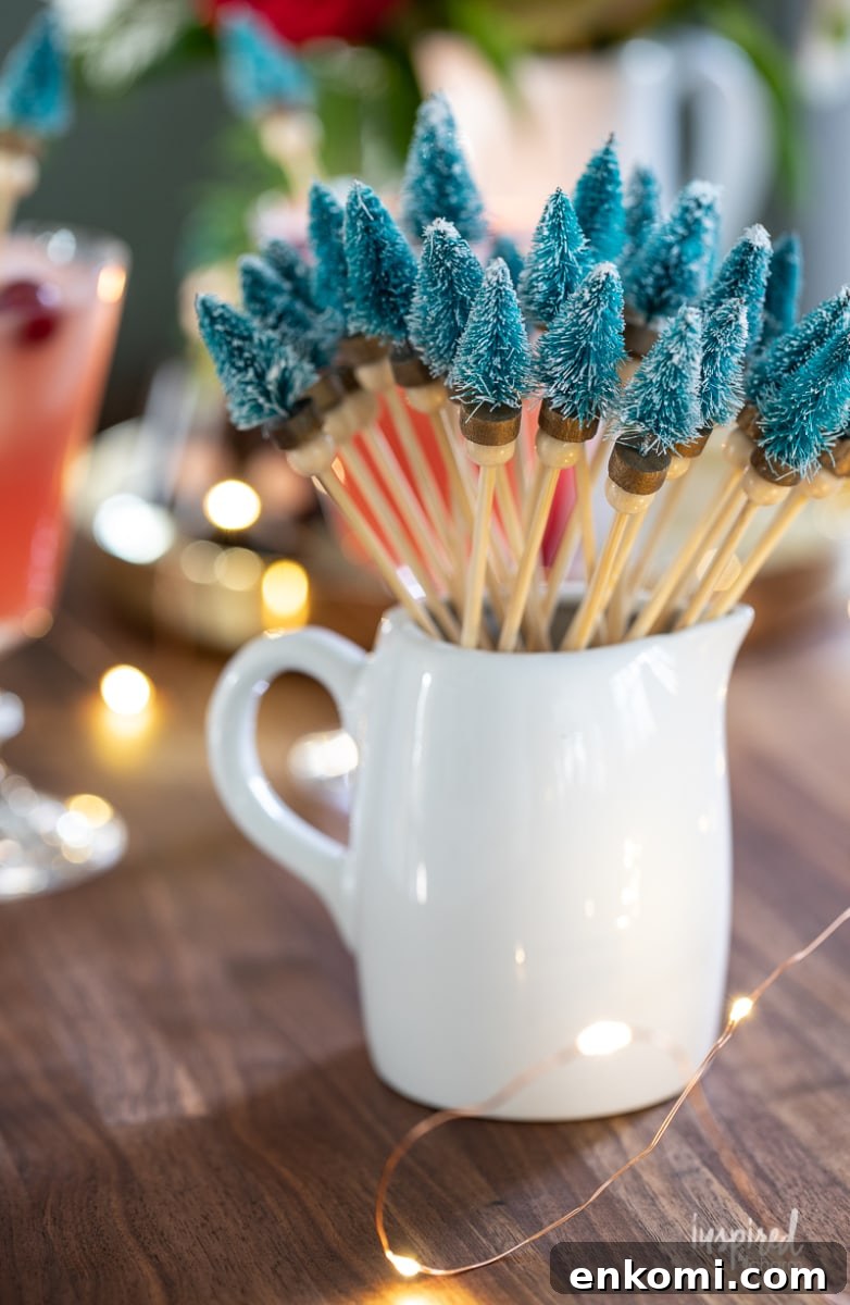 Bottle Brush Tree Drink Stirrers in a small white pitcher.