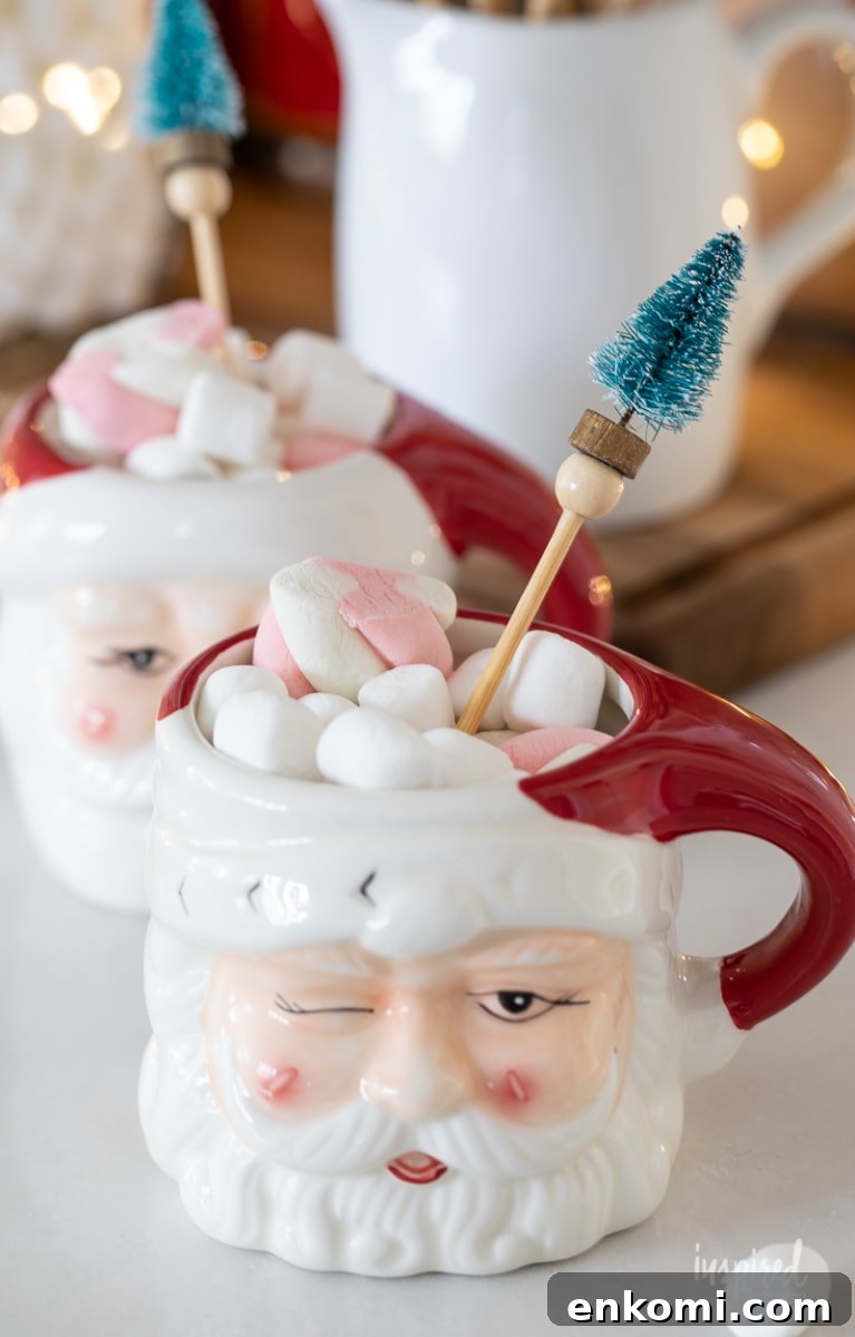 Bottle Brush Tree Drink Stirrers in Santa mugs with cocoa.